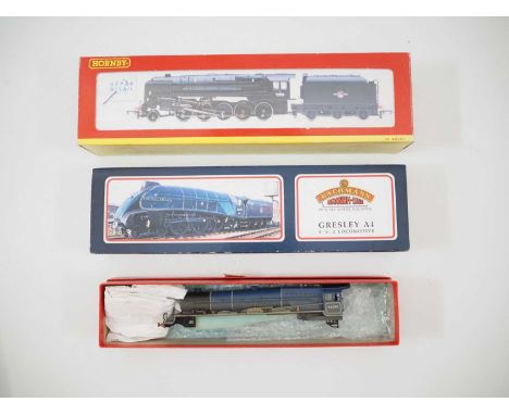 A pair of OO gauge steam locomotives comprising a HORNBY R2105D Class 9F renumbered 92100 and weathered and a BACHMANN Class 