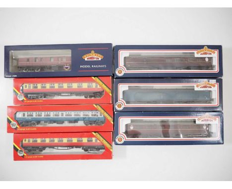 A group of BACHMANN and HORNBY OO gauge passenger coaches in various liveries comprising Thompson, Stanier, MK1 and 2 example