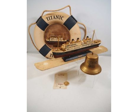 A group of Titanic souvenirs / replica memorabilia to include a scale model, lifebuoy, bell and Centenary coin - G (unboxed) 