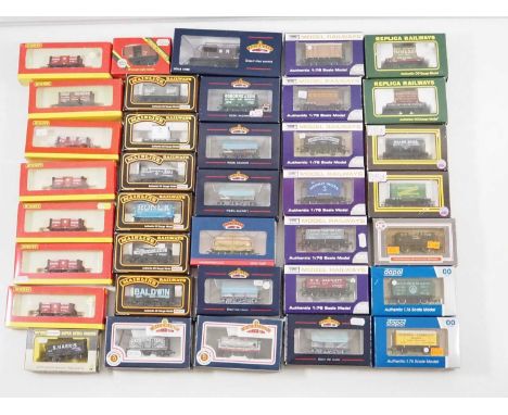 A large group of various OO gauge wagons by HORNBY, DAPOL, BACHMANN and others - VG in G/VG boxed (37)