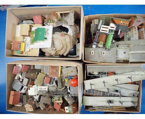 A very large quantity of unboxed HO scale model railways buildings and track accessories in four large boxes - F/G (unboxed) 