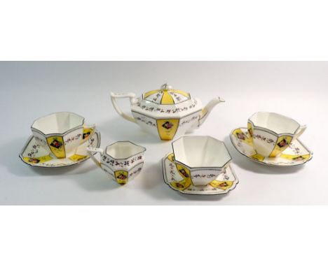 A Shelley Art Deco bachelor tea service painted fruit on yellow and white reserves, No. 11511, comprising teapot, two cups an