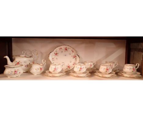 A Royal Albert 'Tenderness' tea service comprising teapot, milk and sugar, six tea cups, saucers and plates plus a cake plate