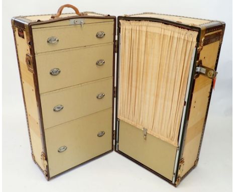An early 20th century Mendel Trunx steamer wardrobe canvas and metal trunk with fully fitted interior, closed 63 x 58 x 107cn