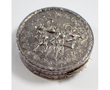A silver circular trinket box embossed cherubs, 5.5cm diameter, import mark 1979