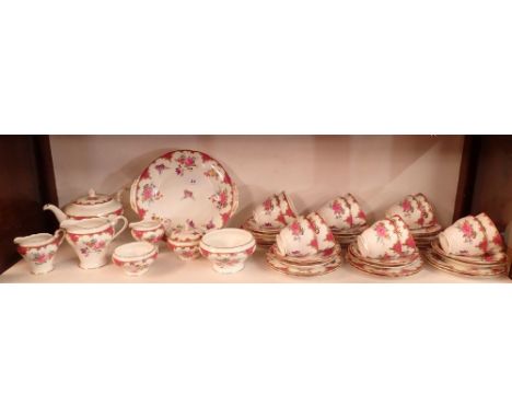 An Aynsley floral tea service comprising thirteen side plates, twelve cups and saucers, two cream jugs, milk jug, two sugar b