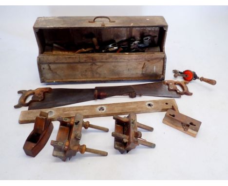 An early 20th century carpenters wooden carry toolbox comprising four drawers with contents of woodworking tools etc. includi