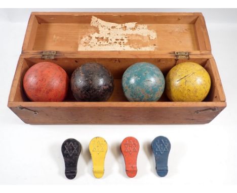 A boxed set of old Jaques croquet balls 