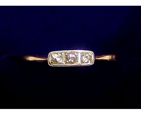 An 18 carat gold and platinum ring set three diamonds, size R, 1.8g
