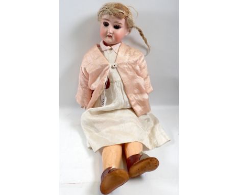 A Simon &amp; Halbig doll marked SH &amp; PB within star, 1909, 3 1/2 with bisque head and composition body, 55cm