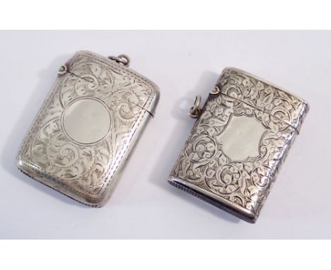 Two silver vesta cases, Birmingham 1899 &amp; 1908, 69g, with engraved foliage decoration