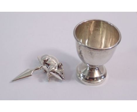 A silver mouse cheese pick, 4.5cm wide and silver egg cup, 50g