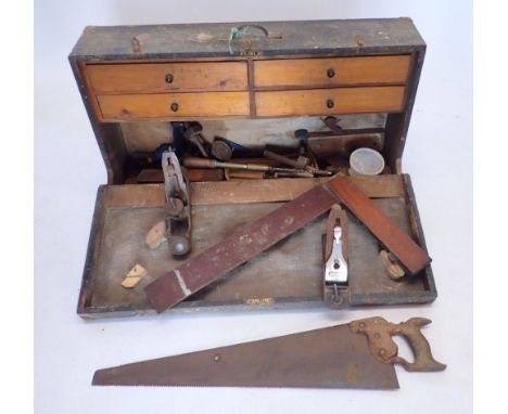 An early 20th century toolbox and contents of woodworking tools etc. including two Stanley hand drills, planes, Eclipse 66 sa