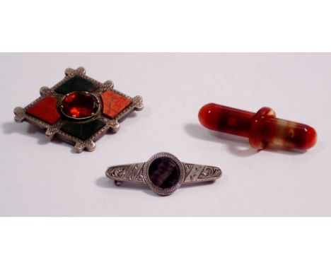 A Victorian Scottish stone set white metal brooch, a silver blue john brooch and an agate brooch