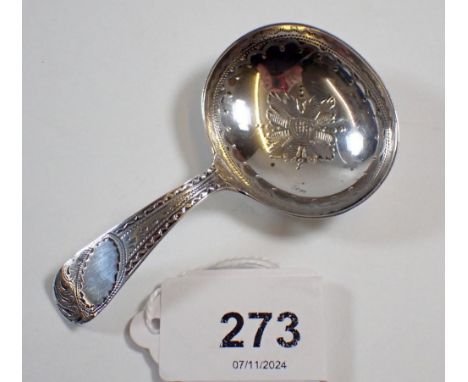 A Georgian silver caddy spoon with bright cut decoration, 12g