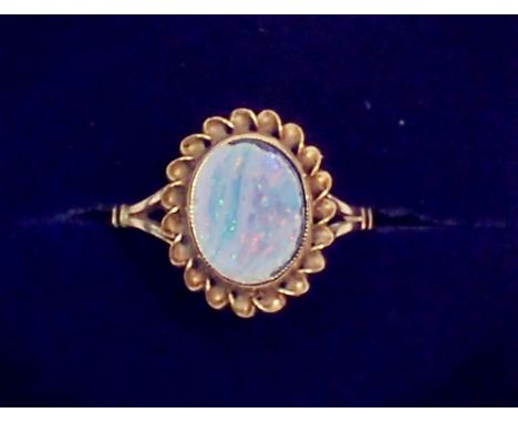 A 9 carat gold ring set oval opal doublet, size K-L, 2.1g