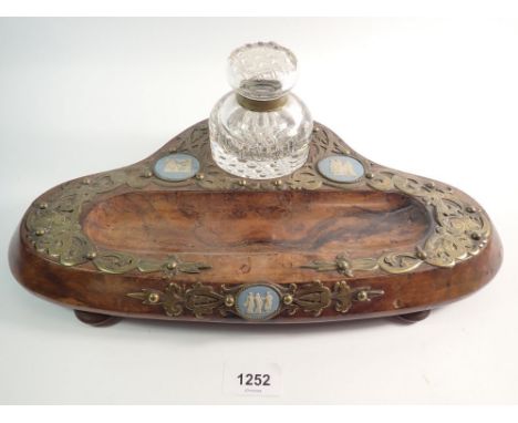A Victorian walnut desk stand with brass mounts and inset Wedgwood Jasperware plaques, with cut glass inkwell, 38cm wide, hin