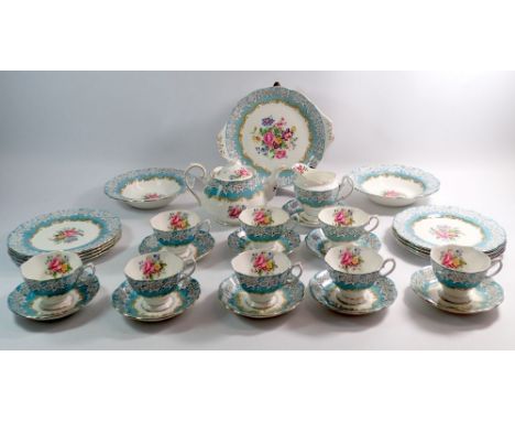 A Royal Albert Enchantment tea service comprising teapot, eight cups and saucers, eight tea plates, cake plate, jug and two d