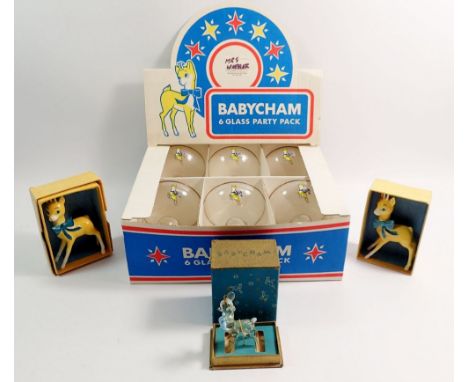Six Babycham glasses, two ceramic deers and a glass deer in original box