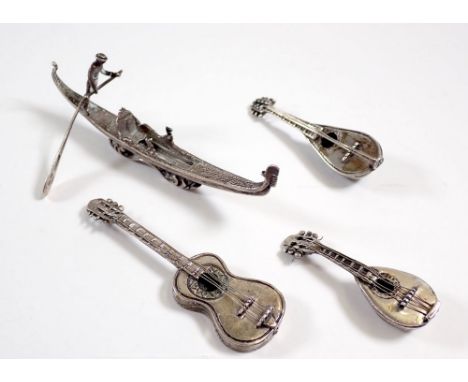 A group of four Italian silver 800 standard miniatures comprising gondola, 9cm, two mandolins and guitar