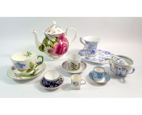 A Rob Turner floral designed teapot together with various cups and saucers from makers including Copelands, Hutschenreuther e