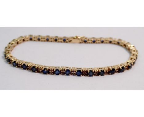 A 9 carat gold sapphire and diamond tennis bracelet, 9.5g