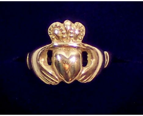 A gold Claddagh ring with two hands holding crowned heart, size Q-R, unmarked, 4.7g