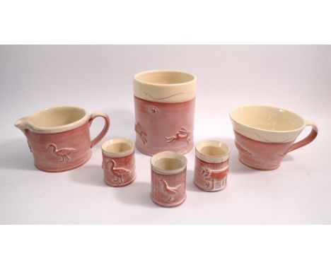 A collection of Philip Wood studio pottery including utensil pot, jug, large coffee cup and three egg cups, tallest 13cm