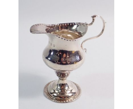 A George III silver cream jug with punched borders, London 1783 by Benjamin Mountigue, 10.5cm tall, 85g