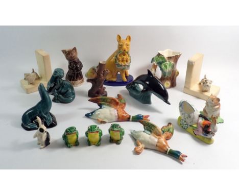 A group of animal ornaments including Poole pottery dolphin, Beswick ducks etc.