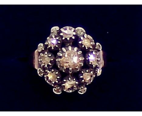 A Georgian cluster ring set old cut diamonds on later yellow metal band, size R, 5.4g