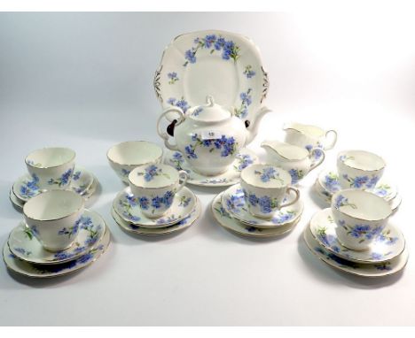 An Adderley tea service decorated cornflowers comprising:- teapot, cake plate, two milk jug, sugar, six cups and six saucers 