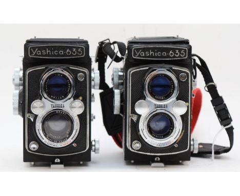 Two Yashica 635 medium format cameras, both with 80mm lenses, serial numbers ST4031519 and SX6100766 