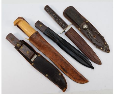 J. Marttiini, Finland a wooden handled knife, signed 15.5cm blade, scabbard, and four other knives. 