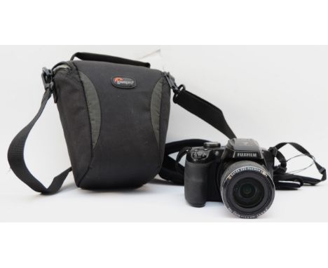 A Fujifilm Finepix S9900W digital camera with case 
