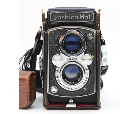 A Yashica Mat dual lens camera, serial number MT8040538, with f=80mm lens, in leather case. 