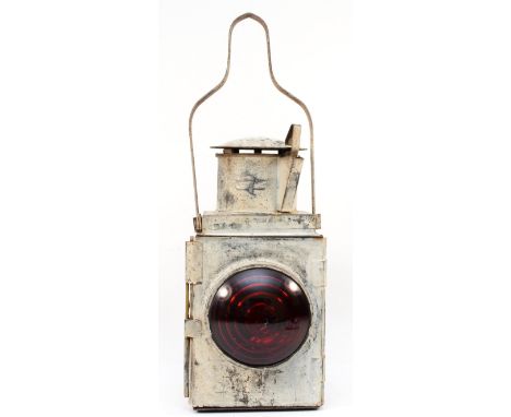 A white BR tail lamp with double arrow logo, complete with burner 