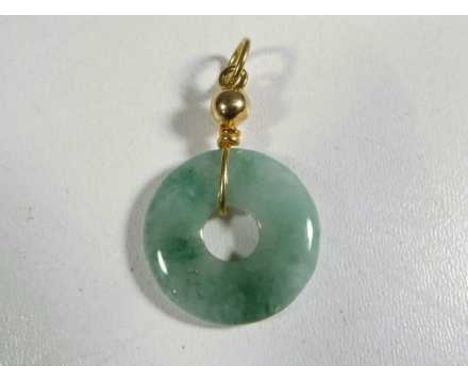 A jade and unmarked 9 carat gold pendant   - This lot MUST be paid for and collected, or delivery arranged, no later than clo