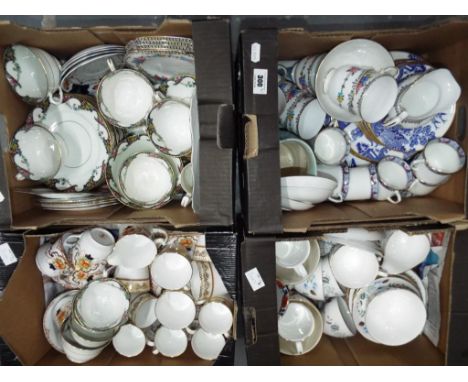 Four boxes containing a quantity of ceramic tableware part tea services to include Colclouch, Elizabethan Swiss Cottage, Tusc