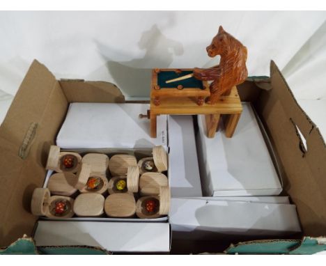 132 novelty wooden pencil sharpeners with hinged lid opening to reveal a pocket bug and a highly carved novelty bear playing 