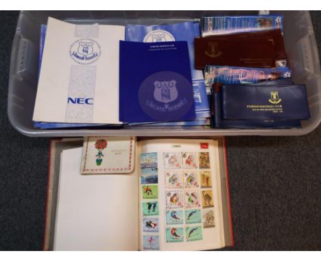 A large quantity of Everton F.C programs from the Blues 100 Club, leather ticket wallets, a vintage autograph book bearing si