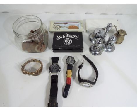 A jar containing a quantity of UK and foreign coins, three wristwatches to include Casio and Tommy Sport, a bangle in the for