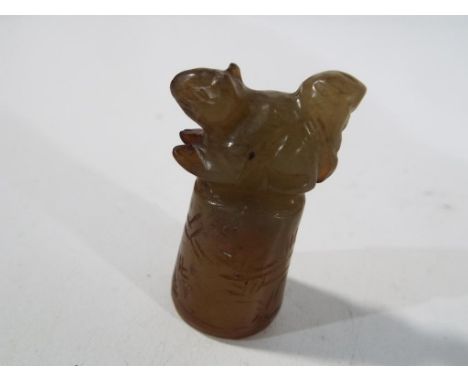 A jade squirrel. Estimate £15 - £20 - This lot MUST be paid for and collected, or delivery arranged, no later than close of b