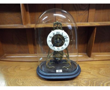 An early 20th century English skeleton style mantel clock, single-train wire fusee 8-day movement, cast brass trapezoid and f