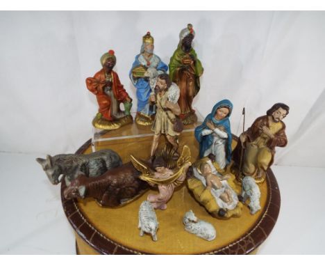 An American Tourister vintage travel case containing figures from  a nativity scene - This lot MUST be paid for and collected
