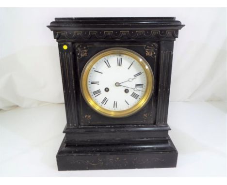 A French black marble mantel clock, 8-day French striking movement behind white enamel dial with Roman numerals, Estimate £20