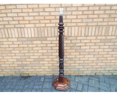 An antique mahogany twist column standard lamp, approximately 173 cm (h) with shade fitting. Estimate £20 - £40 - This lot MU