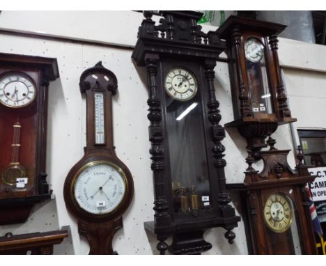 A good Vienna-styled twin weight wall clock by Gustav Becker, medium oak case with turned columns and finials,surmounted by a