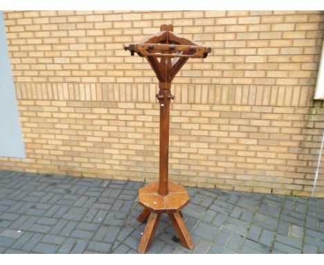 A good quality solid oak hall stand with revolving coat hooks and lower gallery seated area, approximately 175 cm. Estimate £