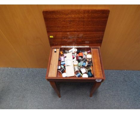A vintage wooden inlaid sewing table with Mapsa musical movement plus contents, 43 cm x 37 cm x 27 cm. Estimate £20 - £40 - T